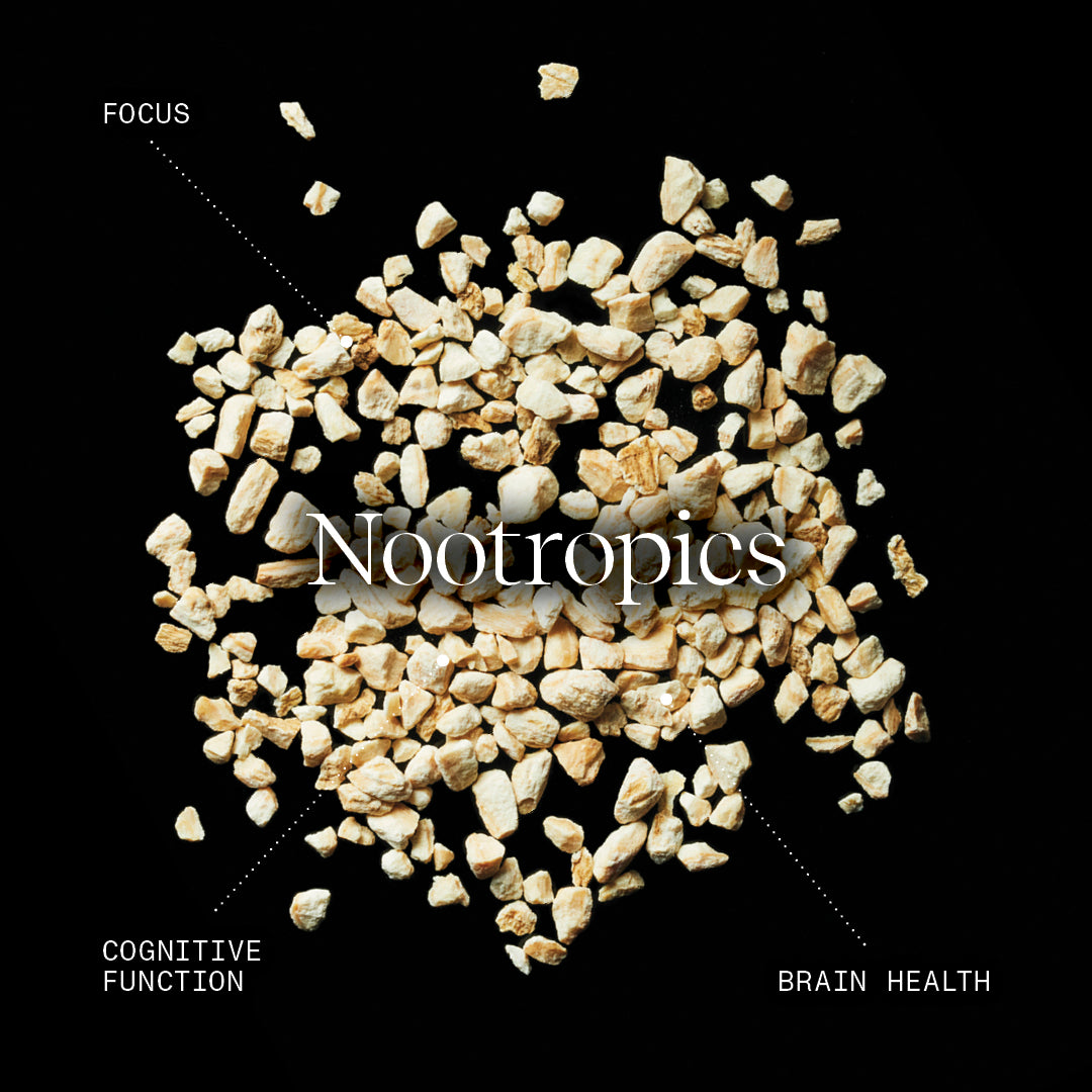 Nootropics text overlay on a pile of small pieces against a black background