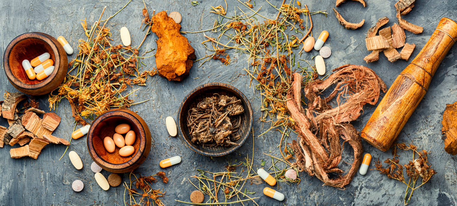Dried herbs and pills mixed on a table