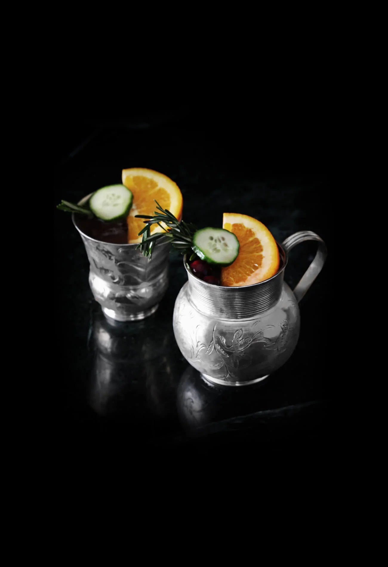 two drinks in silver cups