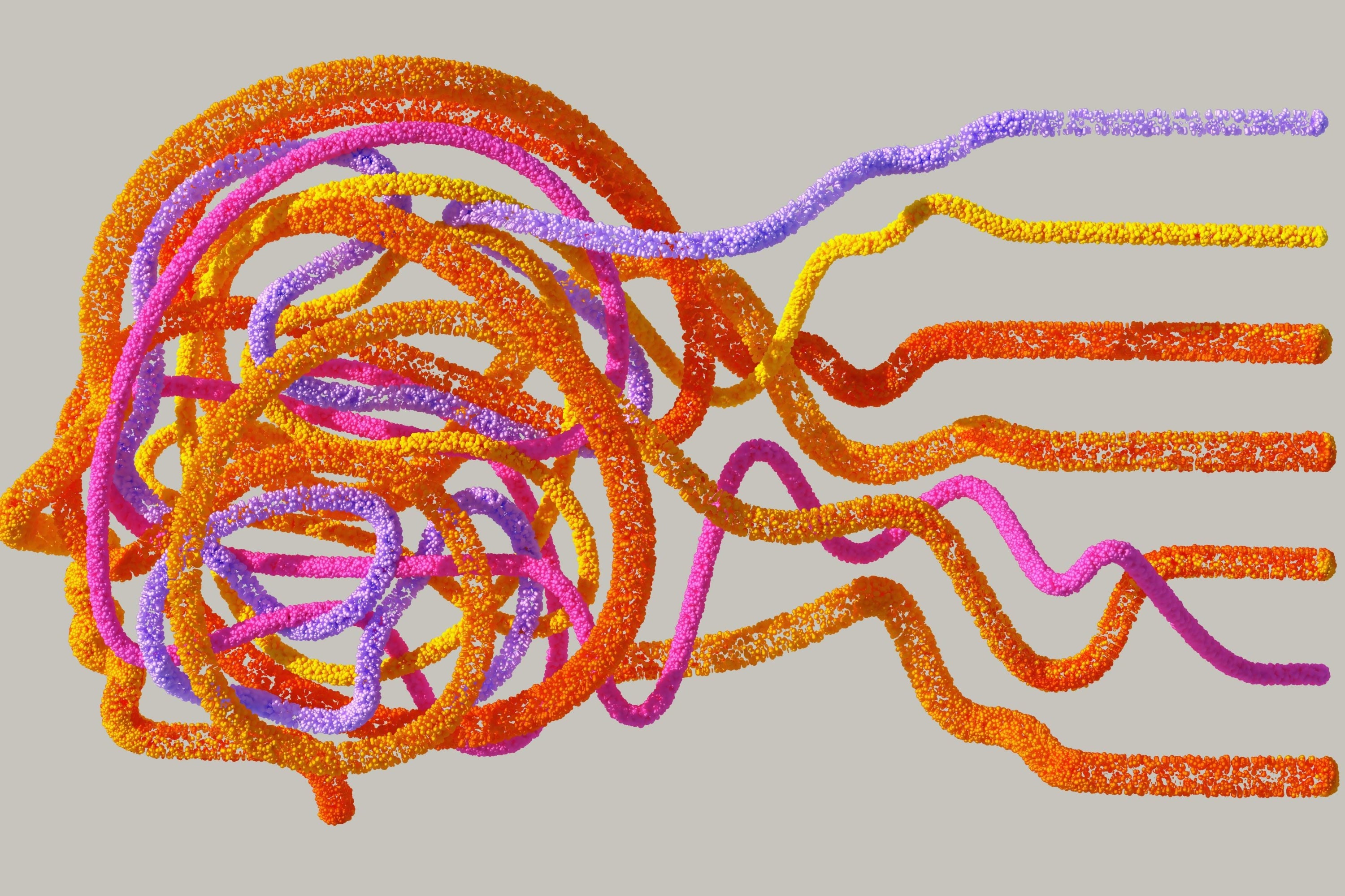 Colorful twisted straw-like objects on a gray background