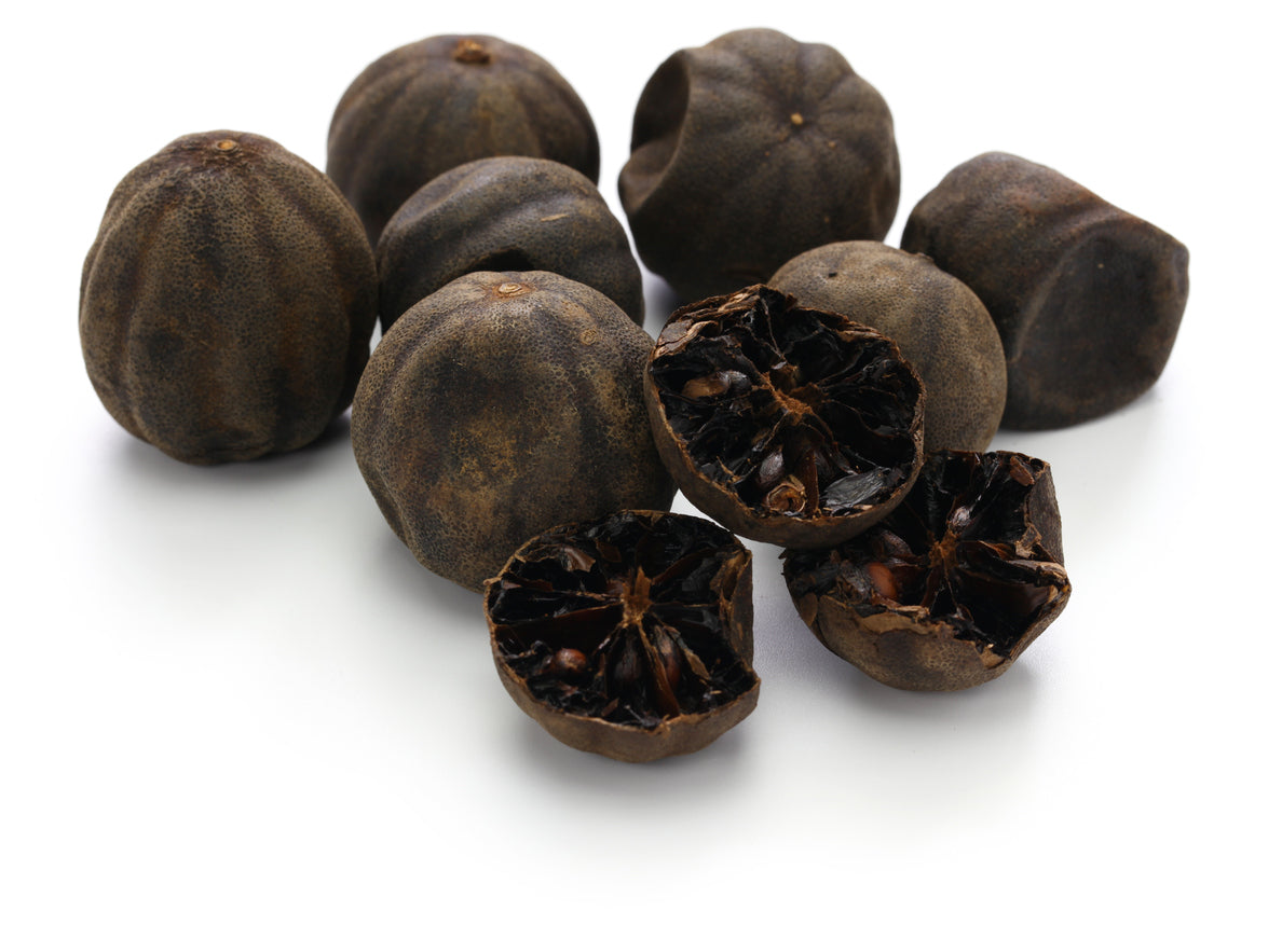 a bunch of black lemons with one open